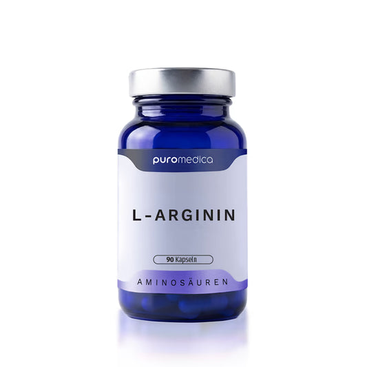Ein blauer Glasbehälter mit einem silbernen Deckel, der 90 Kapseln von L-Arginin enthält, steht vor einem weißen Hintergrund. Der Etikett zeigt den Firmennamen Puromedica sowie die Produktbezeichnung L-Arginin und die Kategorie Aminosäuren.