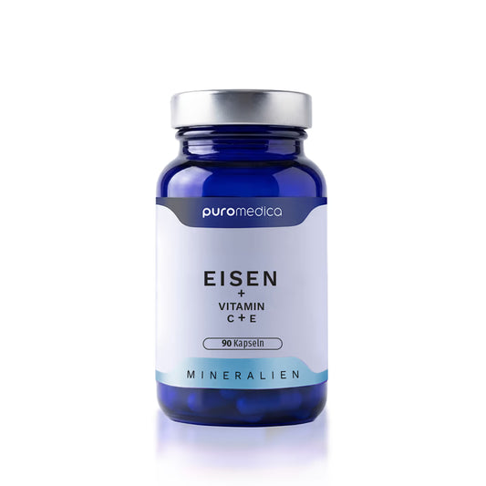 Das Bild zeigt ein dunkelblaues Glasbehältnis mit einem weißen Etikett, auf dem Eisen + Vitamin C + E steht.