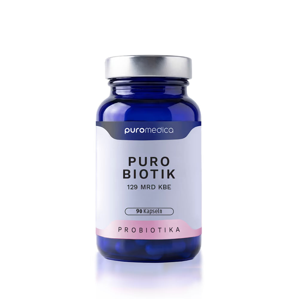 Das Bild zeigt ein bläuliches Glasgefäß mit einem weißen Deckel, das die Puro Biotik Kapseln von Puromedica enthält. Auf dem Etikett sind der Produktname „PURO BIOTIK“ sowie die Angabe „129 MRD KBE“ und „90 Kapseln“ deutlich sichtbar.